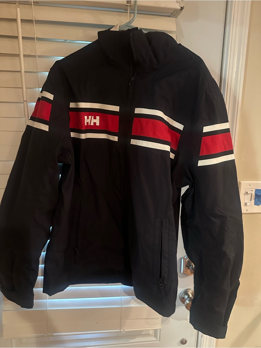 Helly Hansen Men’s Black Jacket with Red & White Stripe Accents